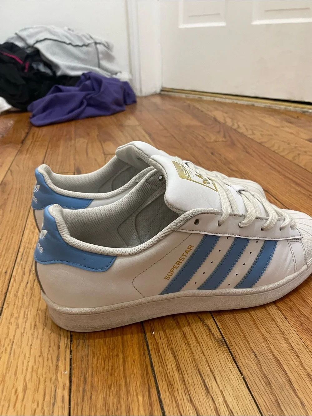 adidas Superstar Men’s Sneakers in White with Light Blue Stripes
